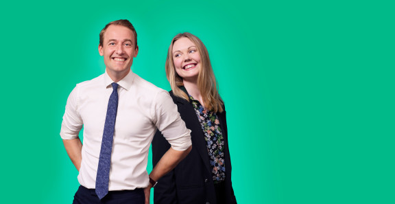 Two employees posing for camera.