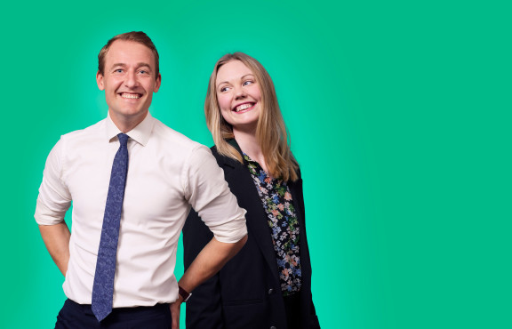 Two employees posing for camera.