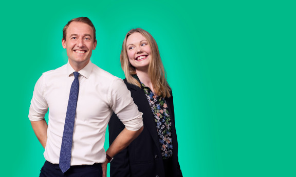 Two employees posing for camera.